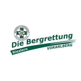 Das Bild zeigt das Logo des Bergrettungsdienstes Österreich. Es ist mit den Worten "Die Bergrettung Riezlern Vorarlberg" sowie einem Emblem mit einer Blume gestaltet. | © Bergrettung Vorarlberg