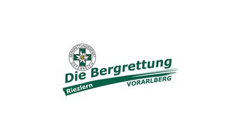 The image shows the logo of the Austrian Mountain Rescue Service. It is designed with the words "The Mountain Rescue Riezlern Vorarlberg" as well as an emblem featuring a flower. | © Bergrettung Vorarlberg