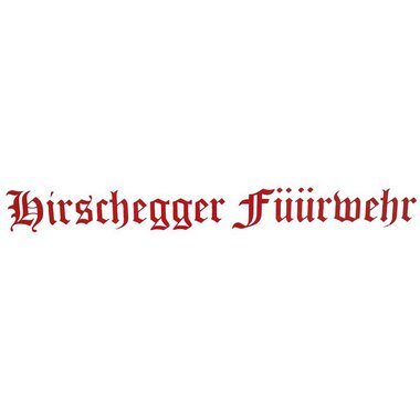 A sign with the inscription "Hirschegger Feuerwehr" in red letters. The letters are designed in a decorative font. | © Kleinwalsertal Tourismus | Feuerwehr Hirschegg