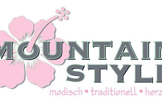 A creative logo with the text "MOUNTAIN STYLE". The design is fashionable and traditional with floral patterns.