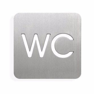 A metallic sign with the inscription "WC". The sign has rounded corners and a modern font.
