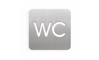 Ein metallisches Schild mit der Aufschrift "WC". Das Schild hat abgerundete Ecken und eine moderne Schriftart.