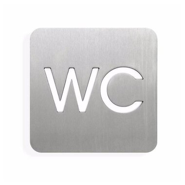 Ein metallisches Schild mit der Aufschrift "WC". Das Schild hat abgerundete Ecken und eine moderne Schriftart.