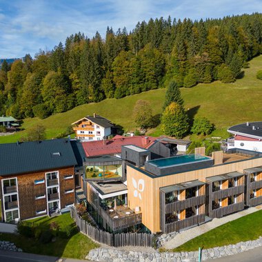 A modern accommodation set amidst a picturesque landscape. Surrounded by forests and gentle hills, it offers a tranquil atmosphere.